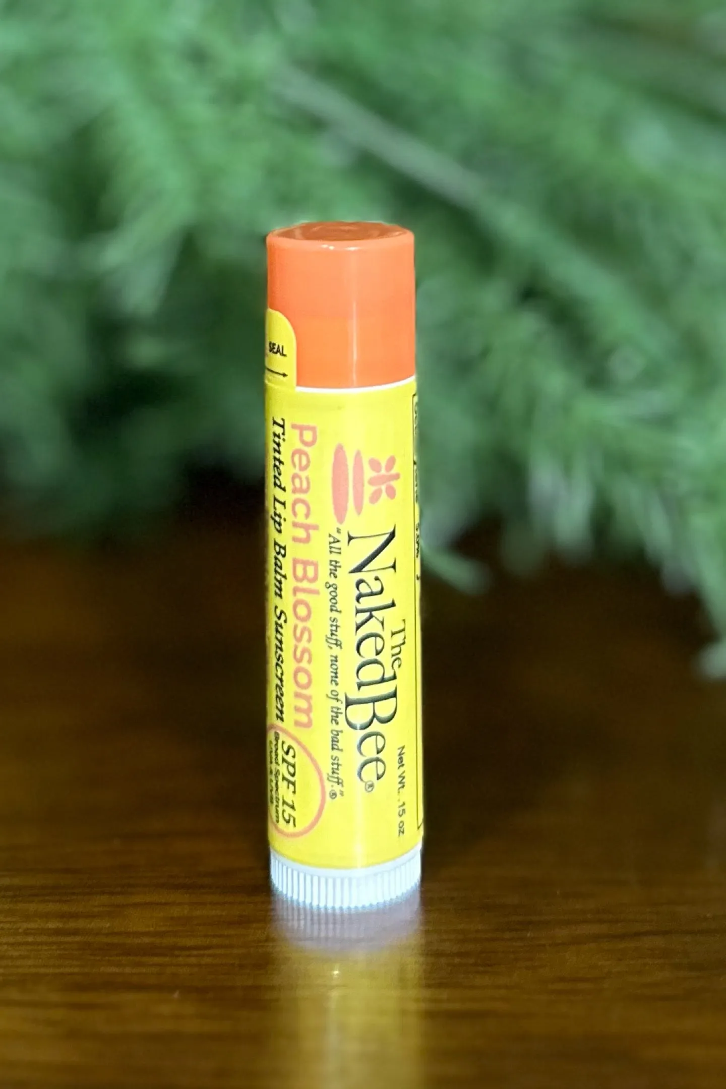 SPF 15 Orange Blossom Honey Tinted Lip Balm in Peach Blossom by Naked Bee